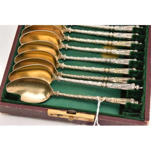 567 - A CASED SET OF TWELVE FRENCH TESPOONS, textured stems with pointed terminals, gilt bowls each stampe... 