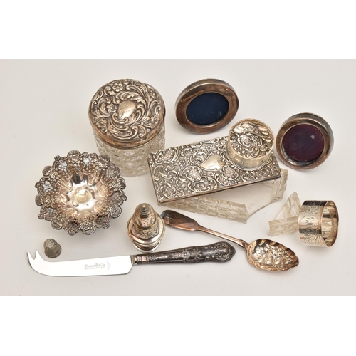 569 - AN ASSORTMENT OF SILVERWARE AND ITEMS, to include two napkin rings, a bonbon dish, a pepperette, a s... 