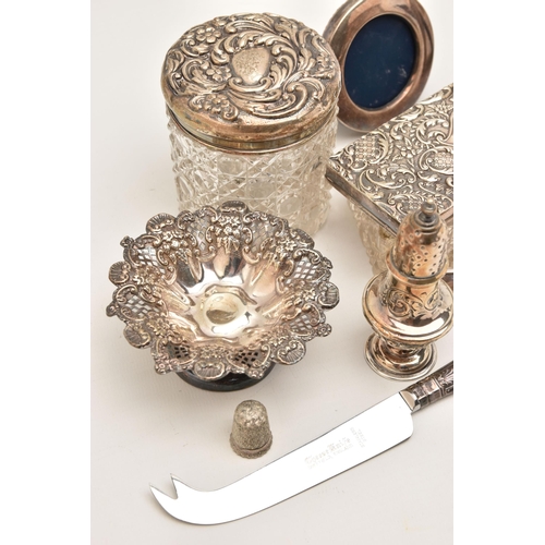 569 - AN ASSORTMENT OF SILVERWARE AND ITEMS, to include two napkin rings, a bonbon dish, a pepperette, a s... 