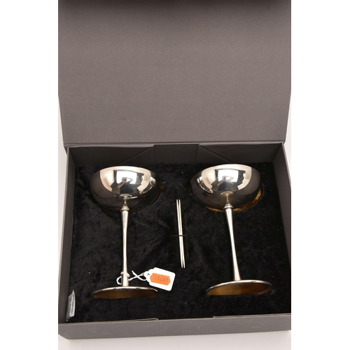 571 - A BOXED PAIR OF ELIZABETH II SILVER CHAMPAGNE BOWLS, polished designs with gilt interiors, thin stem... 