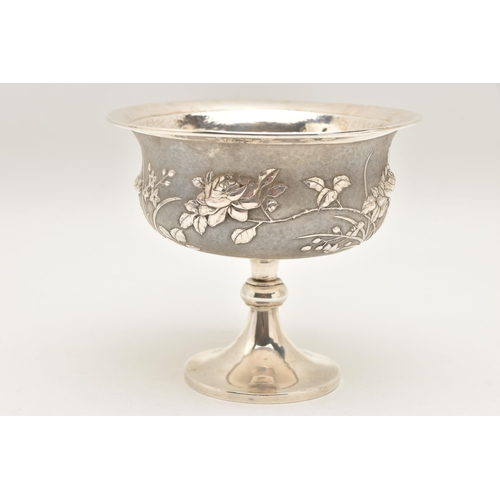 581 - AN EARLY 20TH CENTURY CHINESE SILVER PEDESTAL BOWL, embossed with a floral pattern on a textured bac... 