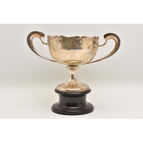 583 - AN EARLY 20TH CENTURY CHINESE SILVER PRESENTATION TWIN HANDLED TROPHY CUP WITH HARDWOOD PLINTH, poli... 