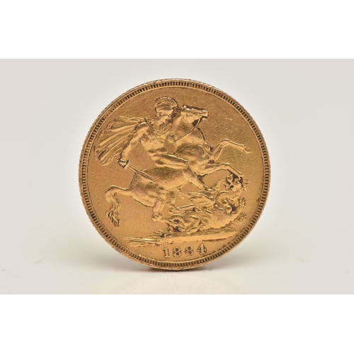 599 - A VICTORIAN FULL GOLD SOVEREIGN COIN, young head, dated 1884, approximate gross weight 7.9 grams, di... 