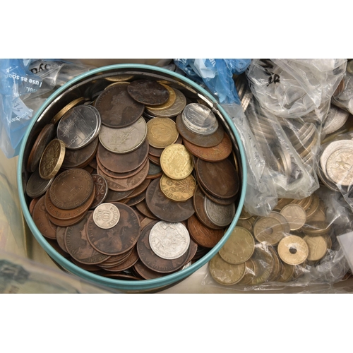 602 - A LARGE AND HEAVY PLASTIC TUB OF MIXED WORLD COINS, to include almost 300 gram of mixed Silver coins... 