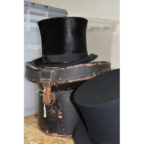 765 - TWO VINTAGE TOP HATS WITH LEATHER CASE, comprising a Lincoln Bennett & Co black silk top hat 59cm wi... 