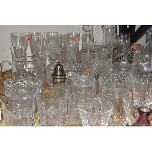 767 - A COLLECTION OF GLASSWARE, to include a quantity of cut glass drinking glasses,  decanters, large de... 