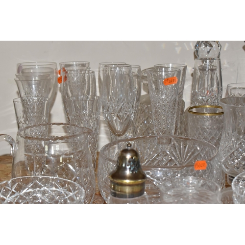 767 - A COLLECTION OF GLASSWARE, to include a quantity of cut glass drinking glasses,  decanters, large de... 