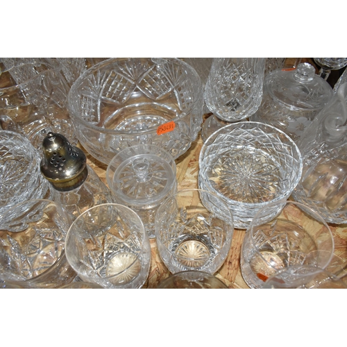 767 - A COLLECTION OF GLASSWARE, to include a quantity of cut glass drinking glasses,  decanters, large de... 