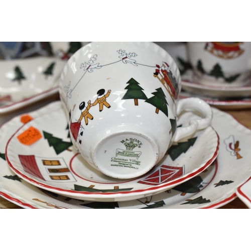 768 - A GROUP OF CHRISTMAS TABLEWARE, comprising Mason's Ironstone 'Christmas Village', 1983, designed by ... 