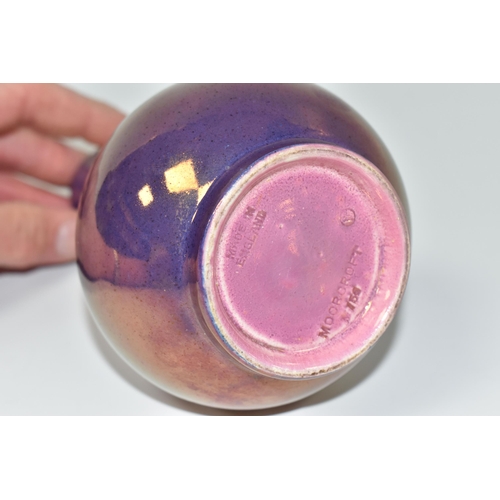 791 - A MOORCROFT POTTERY PURPLE LUSTRE VASE, of globe and shaft form, impressed marks to base, height 15c... 