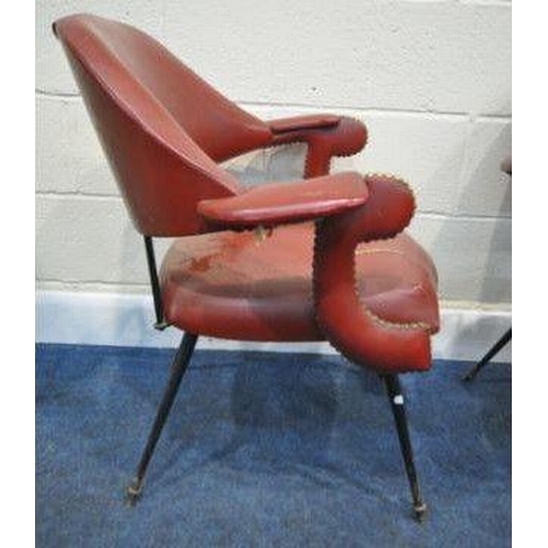 144 - A HARLEQUIN SET OF FOUR RED LEATHERETTE ARMCHAIRS, with a curved backrest, open armrests with brass ... 