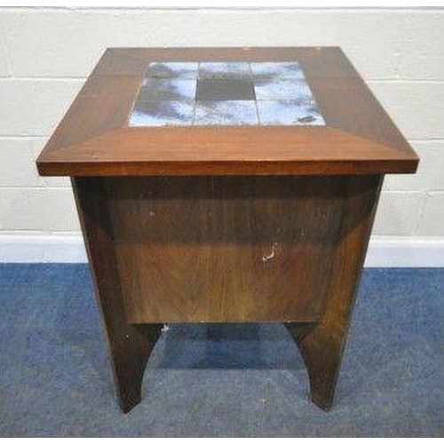 150 - A MID CENTURY ROSEWOOD BAR, the square tile top surrounding a central ice bucket, two sides are plan... 