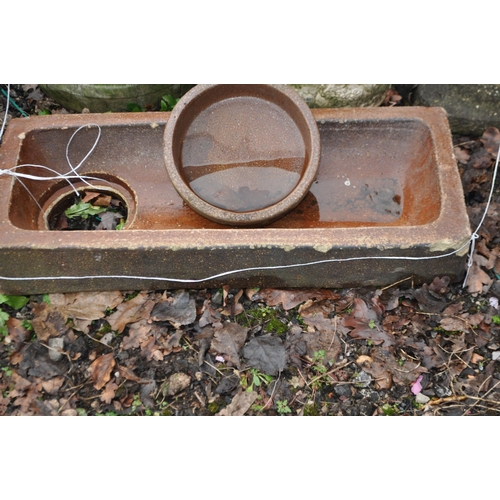 10 - A TREACLE GLAZED WATER TROUGH AND THREE CONCRETE POTS AND BIRD BATH, trough width 68cm, depth 28cm, ... 