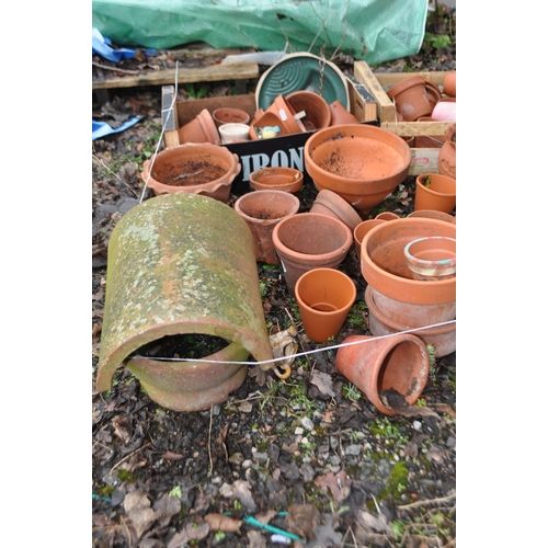 11 - A QUANTITY OF TERRACOTTA GARDEN ITEMS, including a chimney topper, various pots of different sizes a... 