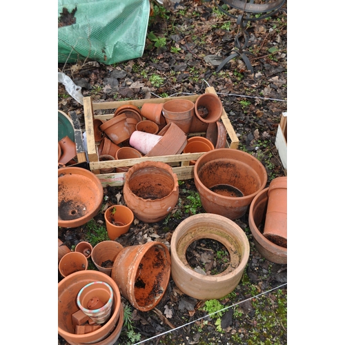 11 - A QUANTITY OF TERRACOTTA GARDEN ITEMS, including a chimney topper, various pots of different sizes a... 