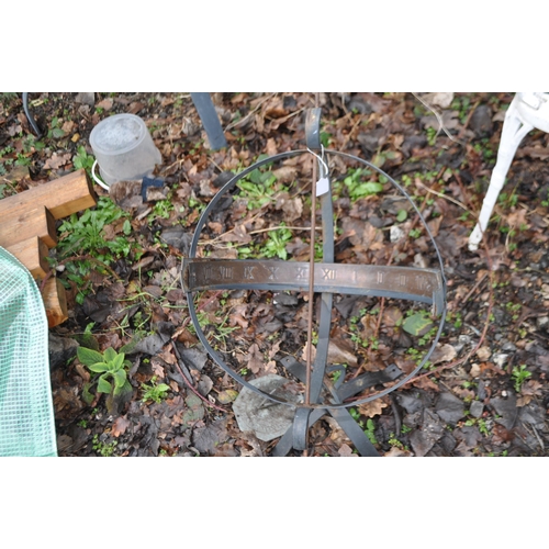 12 - AN ARCHIMEDEAN SUN DIAL with wrought iron frame and sphere and copper dial strip. Condition Report: ... 