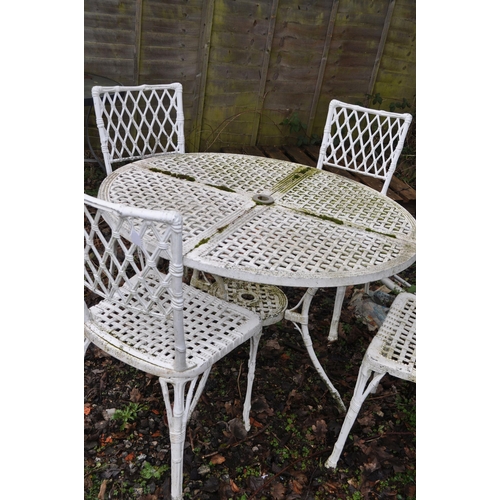 13 - A BAMBOO EFFECT CAST ALUMINIUM GARDEN TABLE AND FOUR CHAIRS with pierced latticework top, diameter 9... 