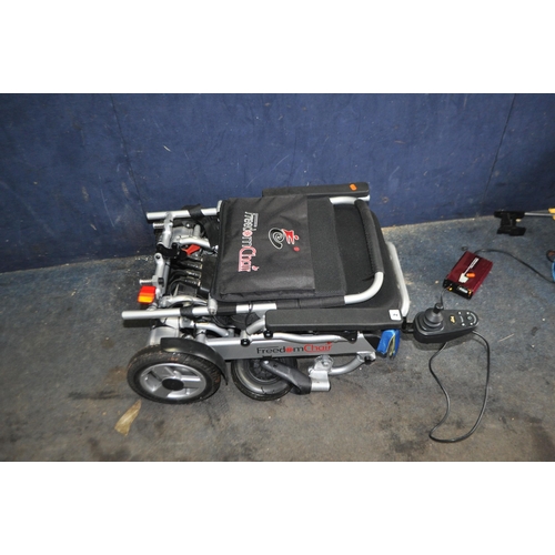 2 - A FREEDOM CHAIR ELECTRIC WHEELCHAIR, with power supply (PAT pass and working) Condition Report: no o... 