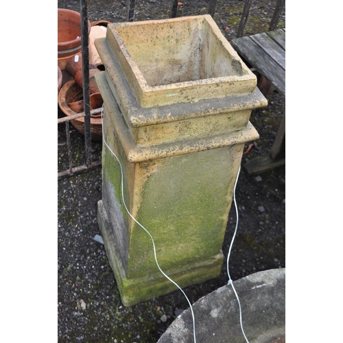 22 - A LARGE RECONSTITUTED STONE PUNCHEON AND A CHIMNEY POT, panchion diameter 77cm (2). Condition Report... 