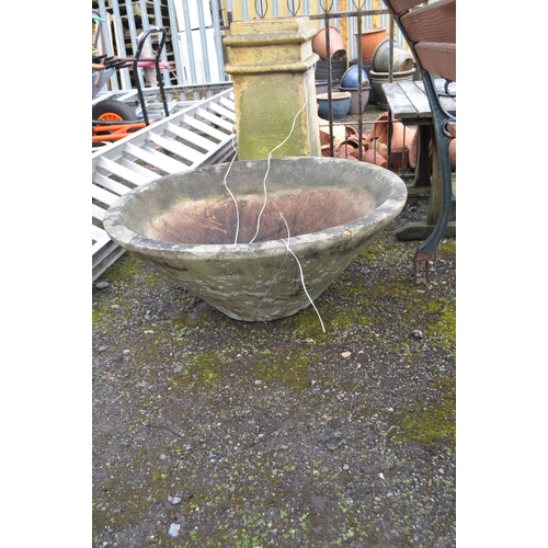 22 - A LARGE RECONSTITUTED STONE PUNCHEON AND A CHIMNEY POT, panchion diameter 77cm (2). Condition Report... 