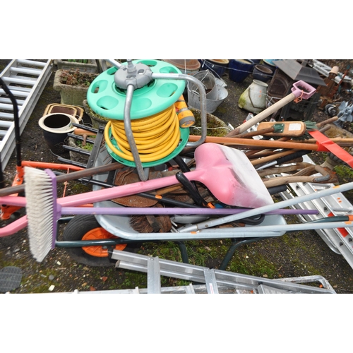 27 - A BUILDERS WHEELBARROW GARDEN TOOLS AND STEP LADDERS (20+)