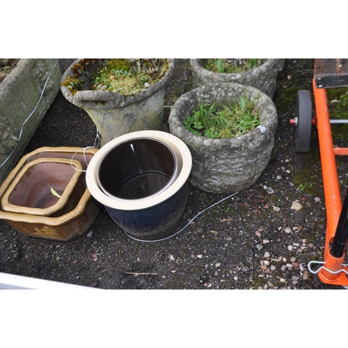 28 - A COLLECTION OF GARDEN PLANTERS including three concrete and four glazed pots (7)