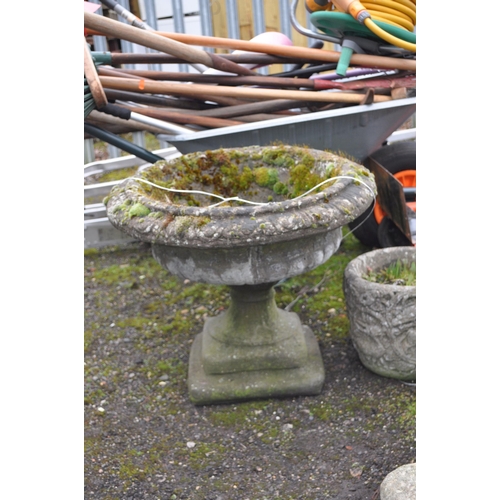 29 - A CONCRETE GARDEN URN constructed in two parts with egg and dart rim detail to balustered fluted bow... 