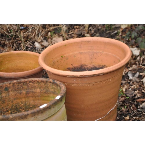 38 - A COLLECTION OF EIGHT TERRACOTTA AND COLOURED GARDEN POTS the largest being  38cm high and stamped Y... 