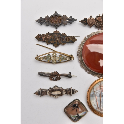 514 - AN ASSORTMENT OF BROOCHES, to include six silver sweetheart brooches, four silver name brooches, all... 