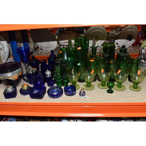 873 - A COLLECTION OF COLOURED GLASSWARE, to include over forty pieces of mainly green and blue glass, a p... 