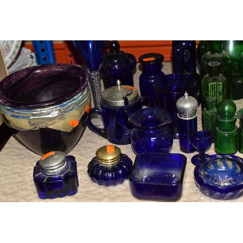 873 - A COLLECTION OF COLOURED GLASSWARE, to include over forty pieces of mainly green and blue glass, a p... 