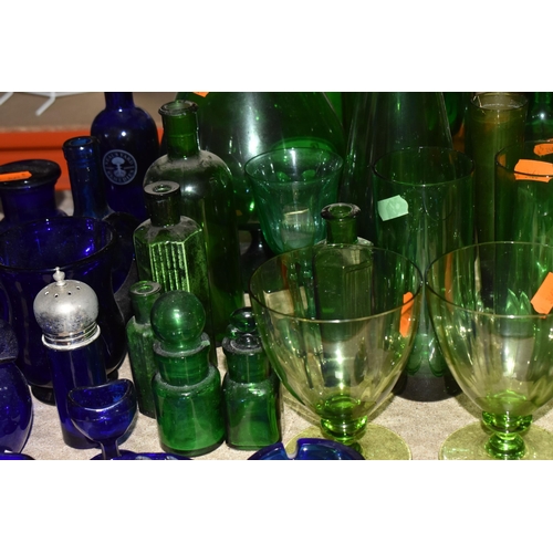 873 - A COLLECTION OF COLOURED GLASSWARE, to include over forty pieces of mainly green and blue glass, a p... 