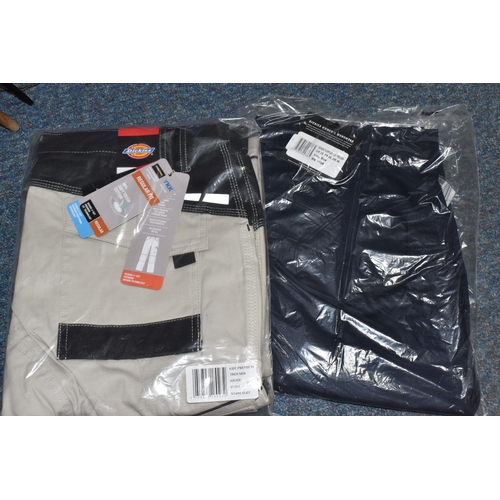 911 - TWO BOXES OF DICKIES WORKWEAR TROUSERS, over twenty pairs of Dickies workwear trousers in various co... 