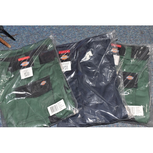 911 - TWO BOXES OF DICKIES WORKWEAR TROUSERS, over twenty pairs of Dickies workwear trousers in various co... 