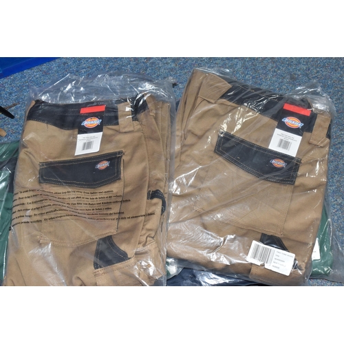 911 - TWO BOXES OF DICKIES WORKWEAR TROUSERS, over twenty pairs of Dickies workwear trousers in various co... 