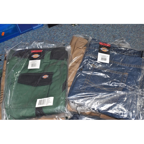 911 - TWO BOXES OF DICKIES WORKWEAR TROUSERS, over twenty pairs of Dickies workwear trousers in various co... 