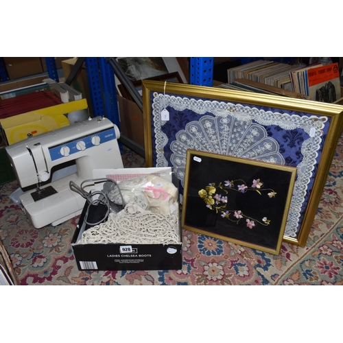 928 - A BROTHER SEWING MACHINE MODEL VX-1200, with operation manual and charger, together with a framed em... 