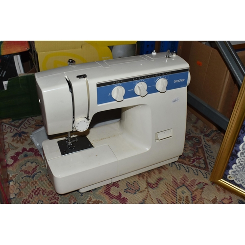 928 - A BROTHER SEWING MACHINE MODEL VX-1200, with operation manual and charger, together with a framed em... 