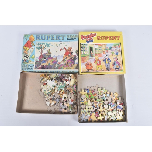 26 - A COLLECTION OF RUPERT THE BEAR RELATED ITEMS, to include assorted jigsaws by Hope/Hestair, contents... 