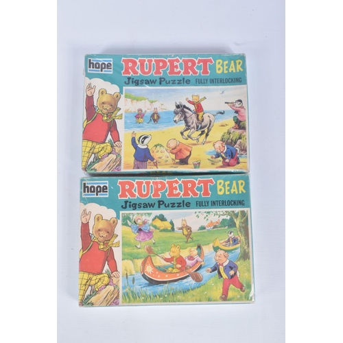 26 - A COLLECTION OF RUPERT THE BEAR RELATED ITEMS, to include assorted jigsaws by Hope/Hestair, contents... 