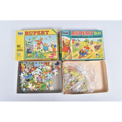 26 - A COLLECTION OF RUPERT THE BEAR RELATED ITEMS, to include assorted jigsaws by Hope/Hestair, contents... 