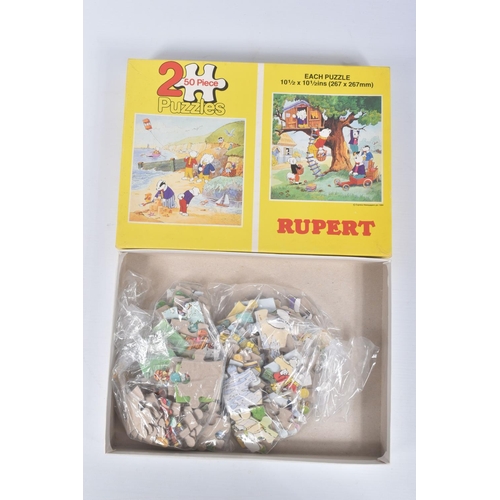 26 - A COLLECTION OF RUPERT THE BEAR RELATED ITEMS, to include assorted jigsaws by Hope/Hestair, contents... 