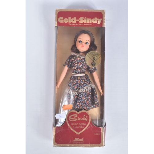 50 - A BOXED SCHUCO GOLD-SINDY, No.14-4816, appears complete with both necklaces and stand and in very go... 