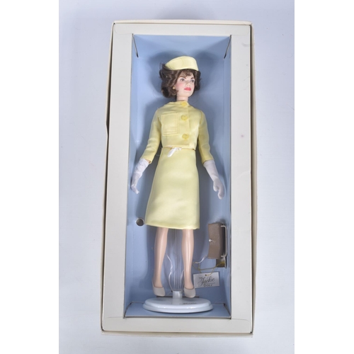 54 - A BOXED FRANKLIN MINT 'THE JACKIE DOLL', vinyl Jackie Onassis doll in yellow satin two piece outfit ... 