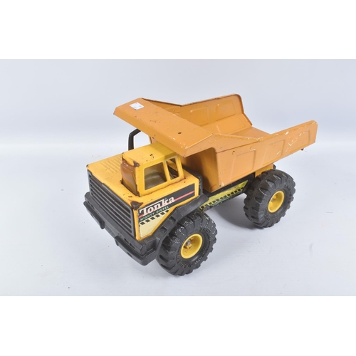 126 - FOUR MIGHTY TONKA TOYS DUMPER TRUCKS, all in playworn condition with paint loss, surface rusting, ma... 