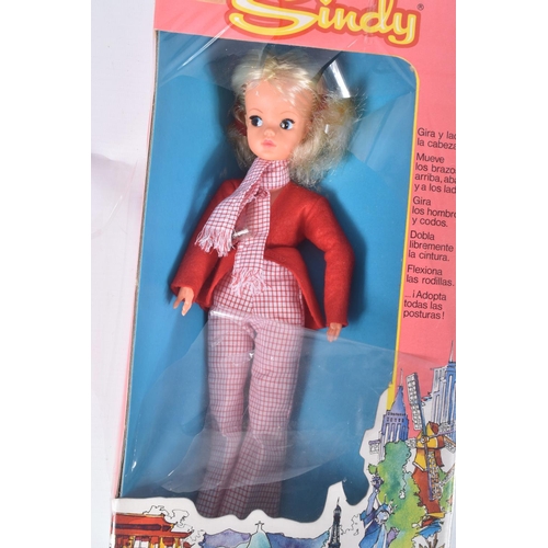 90 - A BOXED SINDY DOLL, in a Exinmex Mexico box, wearing a red jacket, chequered red and white scarf and... 