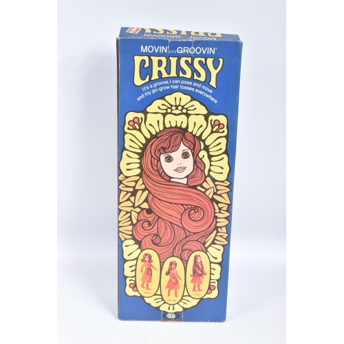 165 - TWO BOXED IDEAL CRISSY DOLLS, the first a 1969 Beautiful Crissy, reference 1051-2, doll wearing a fl... 