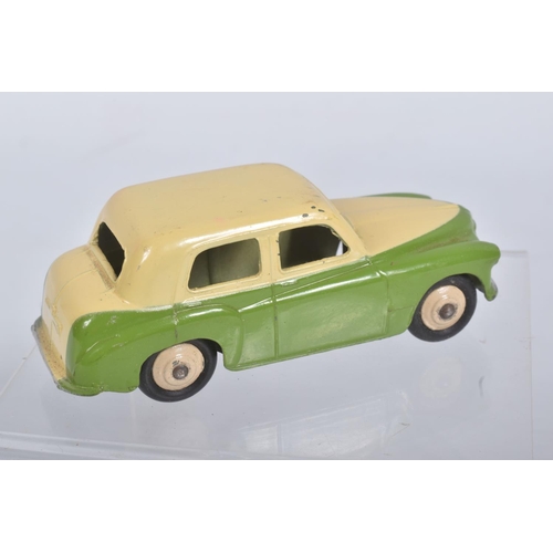 203 - AN UNBOXED DINKY TOYS HILLMAN MINX, No.154, later two tone issue with lime green lower body, cream u... 