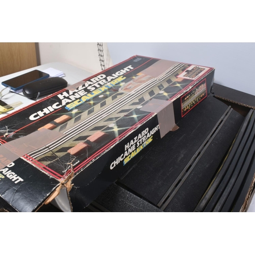 216 - TWO BOXES OF ASSORTED SCALEXTRIC CARS, TRACKS, AND ASSORTED ACCESSORIES, to include a boxed Hazard C... 