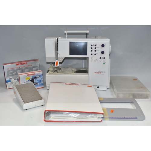 999 - A BERNINA SEWING MACHINE,  'Artista' 180 electric sewing and embroidery machine, together with manua... 